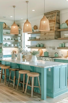 a kitchen filled with lots of counter top space next to wooden shelves and hanging lights