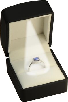 an open box with a ring in it