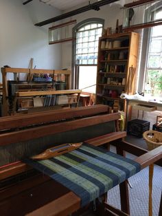 the room has many different types of weaving equipment