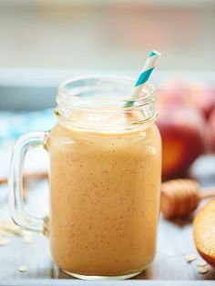 a smoothie in a mason jar with a straw