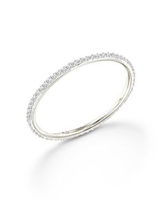 a white gold wedding band with diamonds on the sides and an open design in the middle