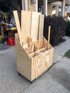 a wooden tool box sitting on top of a sidewalk