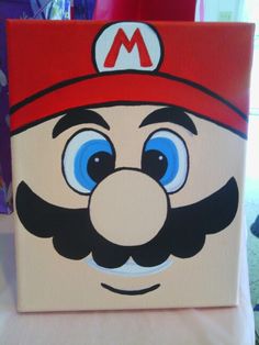 a close up of a box with a mario bros face on it