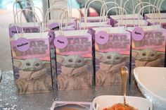 star wars party food and drink bags on a table with silver sequins around them