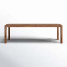 a wooden table on a white background with no one around it or the table is empty