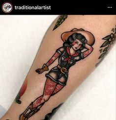 a woman with a cowboy hat and boots on her leg is shown in this tattoo