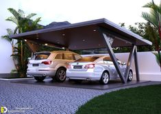 two cars are parked under a covered area