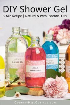 five different types of shower gels with flowers in the background