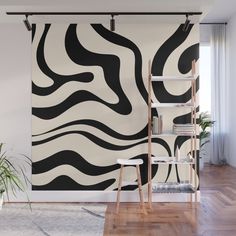 a black and white wall mural with wavy lines