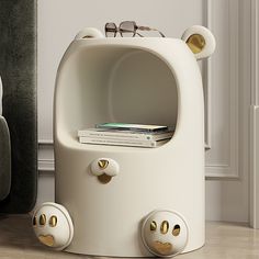 a white bear shaped shelf sitting on top of a wooden floor