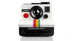 an old polaroid camera with a rainbow lens on it's front and side