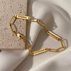 Introducing the Multiple Name Bracelet -- stunning and sophisticated, yet subtle and effortlessly cool. With its distinctive simplicity, this personalized necklace complements any style while still making a timeless statement. Personalize it for yourself or as a special gift for someone special in your life! Make occasions like birthdays, anniversaries, graduations, Mother's Day or Christmas special by gifting them this one-of-a-kind treasure they will cherish for years to come ► PRODUCT INFORMA Affordable Personalized Gold Chain Bracelet, Elegant Personalized Charm Bracelet With Nameplate, Elegant Nameplate Charm Bracelet For Gift, Elegant Nameplate Charm Bracelet Gift, Elegant Personalized Nameplate Charm Bracelet, Elegant Nameplate Charm Bracelet For Personalized Gift, Elegant Customizable Charm Bracelet For Gift, Customizable Nameplate Charm Bracelet, Elegant Nameplate Charm Bracelet For Mother's Day