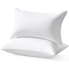 two white pillows sitting next to each other