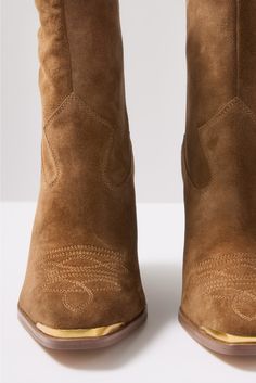 Kick off the season in style with the Abel Western Bootie by Vince Camuto. These pull-on boots are crafted in soft brown suede and feature a stacked block heel, Western-style stitching, and a pointed toe with a gold metal detail. Western Booties, Pull On Boots, Shoe Closet, Fall Shopping, Brown Suede, Fall Trends, Ankle Booties, Work Fashion, Flat Shoes Women