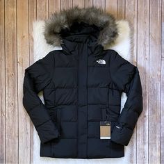 New With Tags- The North Face Women’s Gotham Water Resistant Jacket In Tnf Black With Fixed Adjustable Hood With Removable Faux-Fur Ruff, Front Zip Closure With Stormflap, Zippered Hand Pockets, Interior Zippered Pocket, Hem Cinch Cord, 550 Fill Goose Down Insulation And Heatseeker Eco Insulation. Standard Fit. The North Face Winter Outerwear With Detachable Hood, The North Face Winter Workwear Outerwear, Black Parka For Work, The North Face Black Puffer Jacket For Winter, Fitted The North Face Outerwear For Fall, The North Face Jackets Outfits, North Face Coats, North Face Jacket Outfit, North Face Metropolis Parka