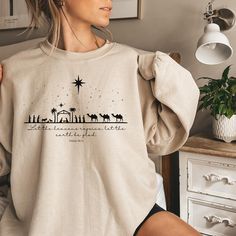 Are you looking for Christian Christmas Sweatshirt ? We got you! Celebrate the true meaning of Christmas with this beautifully simple nativity scene shirt. Featuring a classic silhouette of the Holy Family, this design is a gentle reminder of the season's message of love, peace, and hope. Perfect for anyone looking to share their faith and spread holiday cheer with a timeless, meaningful look. ✅ ABOUT OUR Nativity Scene Crewneck ▸  These garments are made from polyester and cotton.  ▸ The collar Christmas Christian Shirt Ideas, Nativity Shirts Vinyl, Christmas Christian Tshirts, Cute Christian Christmas Shirts Vinyl, Jesus Tee Shirts, Nativity Scene Sweatshirt, Scene Shirt, Tee Shirt Outfit, Jesus Tees