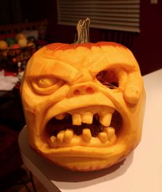 a carved pumpkin with an angry face on it