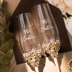 two champagne flutes with the names mr and mrs on them