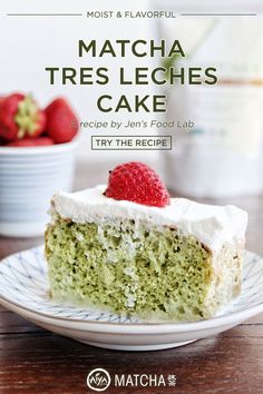 a piece of matcha tres leches cake on a plate with strawberries in the background