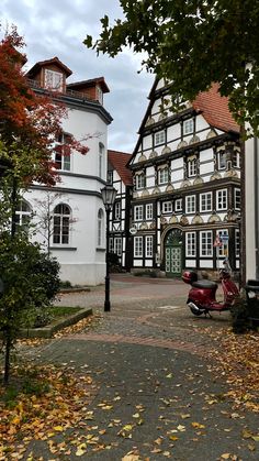 a scooter is parked in front of an old building