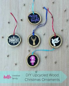 christmas ornaments made out of wood are hanging on a table with text overlay that says diy upcycled wood christmas ornaments