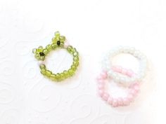 Beaded ring Seed beads jewelry Frog ring  These beautiful beads rings are so cute and adorable. The rings are threaded by hand , made from sead beads with lots of love. Easy to match with your daily style and you can also layer with other rings!  Choose your ring form 3 styles: 1 Frog ring 2 Pink ring 3 White ring Choose your measures: 3-4 US - 44,2-44,8 mm 4-5 US - 46,8-49,3 mm 5-6 US - 49,3-51,6 mm 6-7 US - 51,6-54,4 mm 7-8 US - 54,4-57,0 mm 8-9 US - 57,0-59,5 mm 9-10 US - 59,5-61,2 mm Materials - 3mm Glass Beads Bead Frog Ring Tutorial, Frog Bead Ring Pattern, Cute Beaded Rings For Gifts, Green Beaded Rings For Gifts, Green Beaded Rings For Gift, Cute Green Round Bead Jewelry, Cute Spacer Beads For Jewelry Making, Handmade Cute Green Ring, Handmade Cute Green Rings