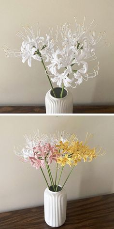 two vases filled with flowers sitting on top of a wooden table next to each other