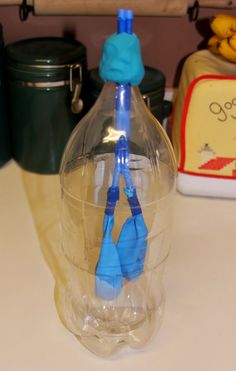 there is a plastic bottle with blue handles on it