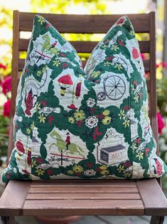 a pillow sitting on top of a wooden bench