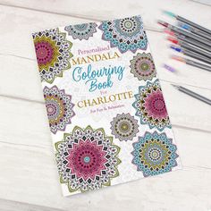 an adult coloring book with markers and pens