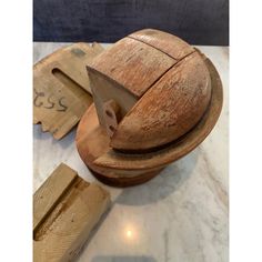 a wooden object sitting on top of a counter