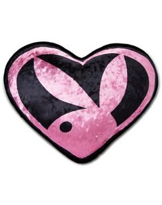 a pink and black heart shaped pillow with an image of two rabbits in the center