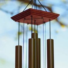 a wind chime hanging from a tree branch