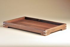 a wooden tray sitting on top of a table