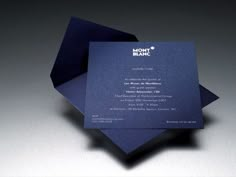 a blue and black business card with the word mont blanc on it