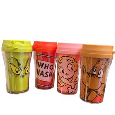 three different colored cups with cartoon characters on them