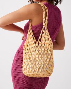 Chunky beads in an open lattice design give the FIJI bag a beachy vibe with a drawstring lining to keep all your valuables secure. Beaded shoulder bag Lined interior with drawstring closure Interior zipper pocket Open lattice beading 11.5in H x 7in W x 7in D Synthetic materials Duster bag included Imported Summer Vacation Beaded Shoulder Bag, Summer Beaded Shoulder Bag For Daily Use, Beaded Shoulder Bag For Daily Use In Summer, Summer Hobo Bag With Braided Handles And Pouch Shape, Bohemian Beaded Shoulder Bag For Beach, Summer Beaded Pouch Bag, Bohemian Beaded Shoulder Bag For The Beach, Summer Beaded Rectangular Beach Bag, Summer Vacation Beaded Beach Bag