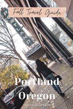 a woman walking down the sidewalk in front of a store