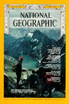 the front cover of national geographic magazine, featuring two men on top of a mountain