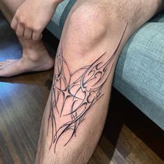 a man's leg with a tattoo on it