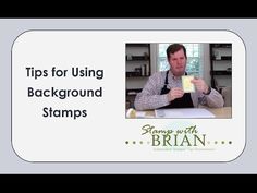 a man sitting at a table holding up a piece of paper with the words tips for using background stamps