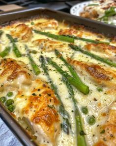 a casserole with asparagus and cheese in a pan on a table