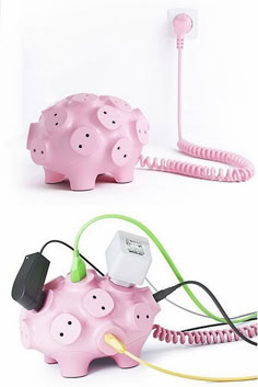 a pink pig shaped device connected to a cord and plugged into a phone charger