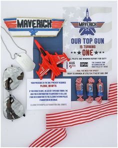 an assortment of patriotic items including a toy airplane and other accessories are displayed on a white surface