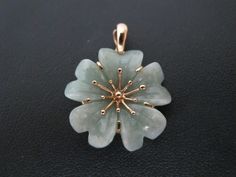 "Darling 14k yellow gold carved jade flower pendant, measures 1 1/4\". Jade measures 24.5mm. Total weight of 6.1 grams. Hallmarks at back. 10650-44" Jade Flower, Jade Flower Necklace, Handmade Jade Flower Necklaces, Green Jade Flower Necklace, Jade Pendant Flower, Jade Flower-shaped Jewelry For Gifts, Jade Necklace Pendant Chinese, 14k Yellow Gold Necklace, Floral Pendant