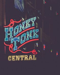 a neon sign that says honey honks to central