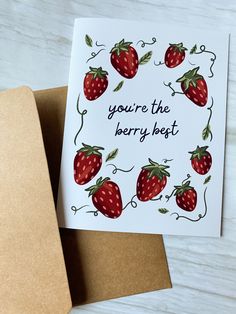 a card that says you're the berry heart on it and has strawberries