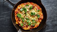 a pizza sitting in a pan on top of a table