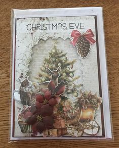 a christmas eve card with poinsettis and bells on it's front