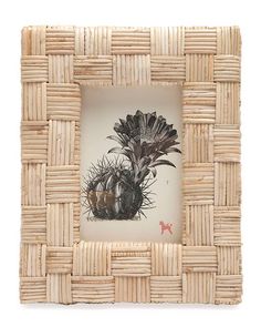 a photo frame made out of wicker with an image of flowers in the center